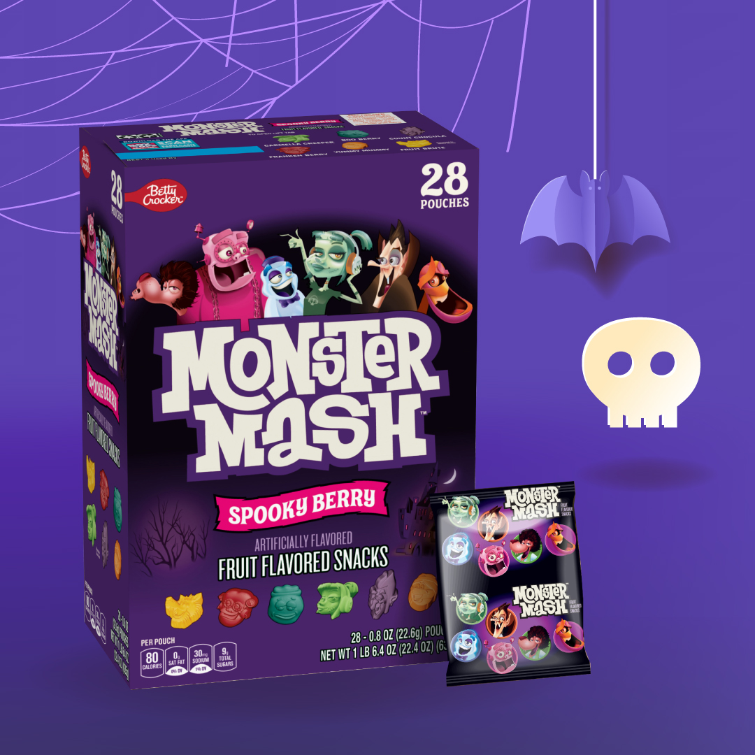 Monster Mash Fruit Snacks box and individual pouch displayed on a purple background with spider web, bat, and skull illustrations.